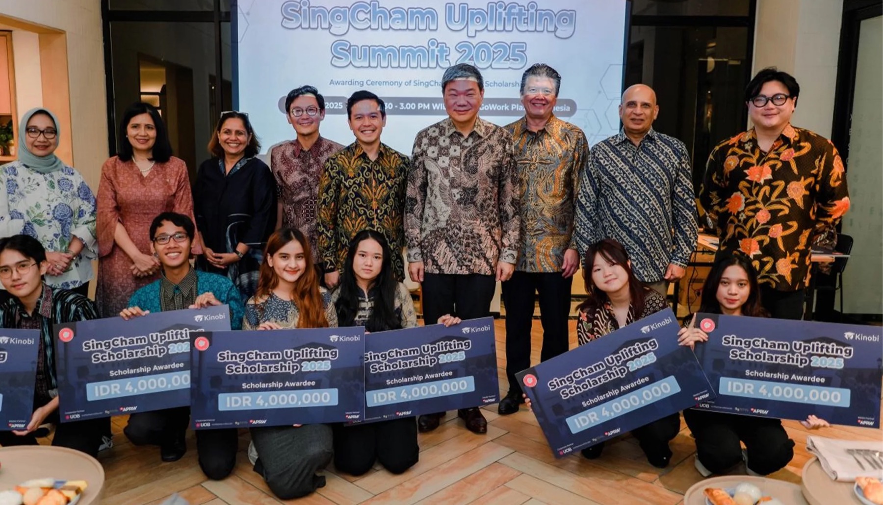 Scholarship recipients on stage with SingCham leaders at the SingCham Uplifting Summit 2025